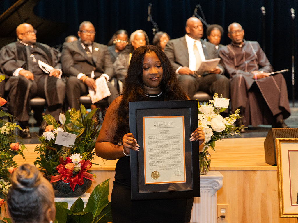 SGA President Kennedy Williams at Dr. Bryant's service.