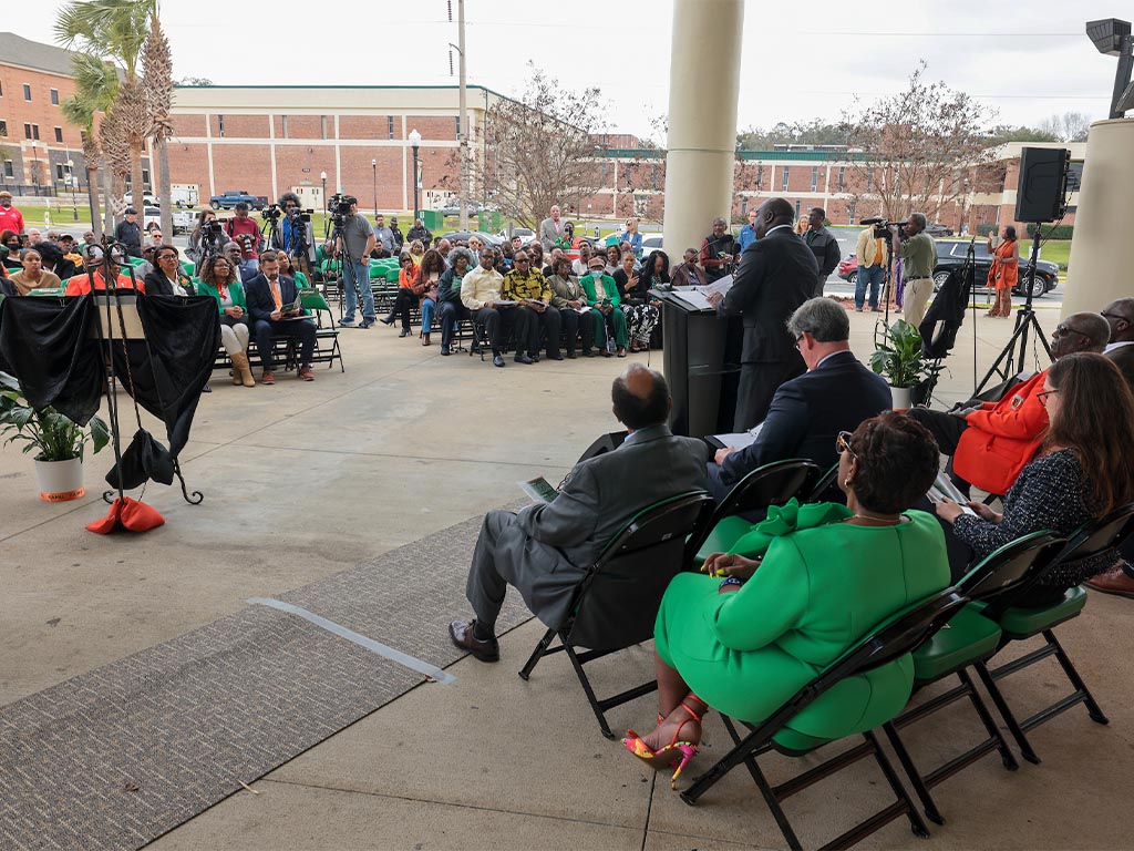 crowd at street name unveiling