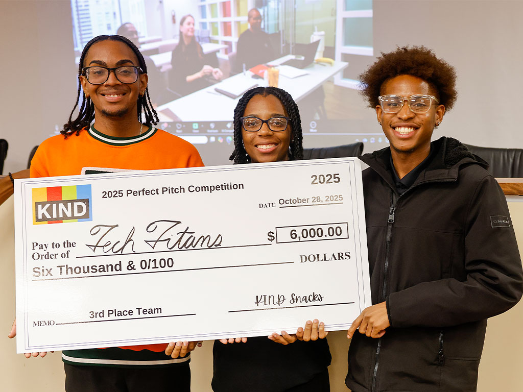 Members of Team Tech Titans celebrate their $6,000 third-place win at the 2025 KIND Perfect Pitch Competition.