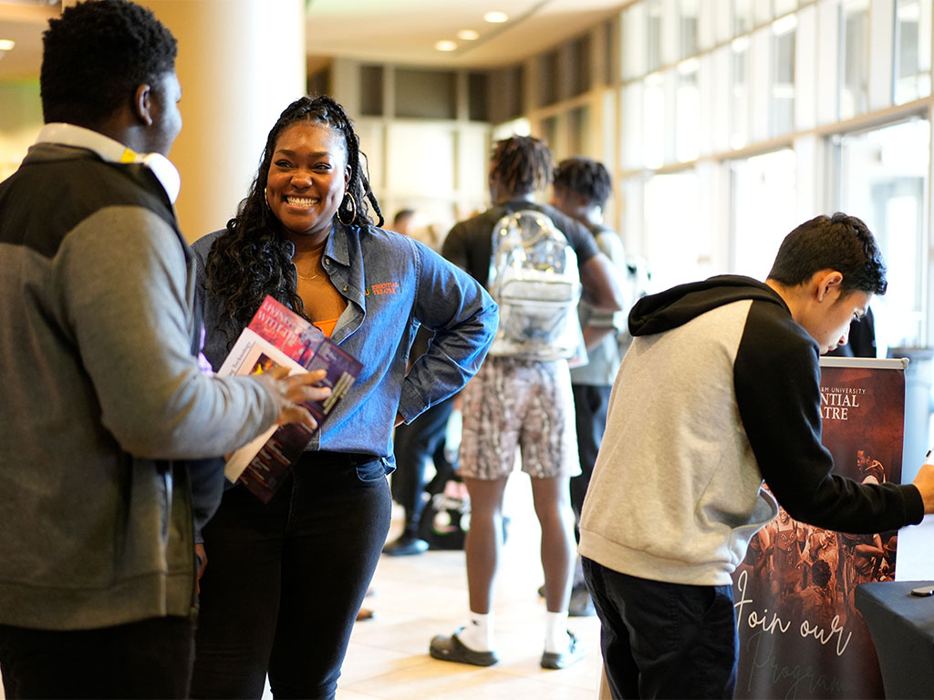 A Florida A&M University representative connects with a prospective student during a recruitment event, highlighting the personal interactions that help future Rattlers explore academic programs, campus life and opportunities at the University.