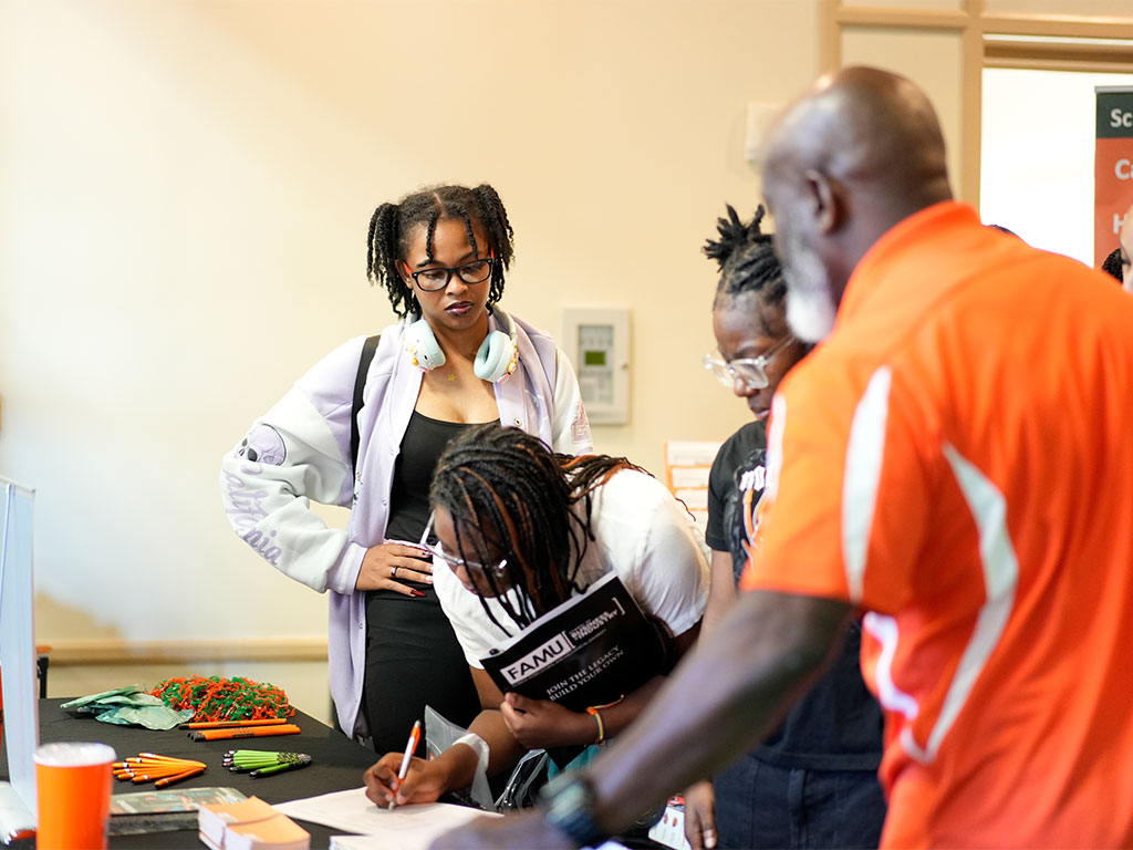 Prospective students engage with FAMU representatives during a recruitment event, exploring admissions information, academic opportunities and campus life as they take the next steps toward becoming Rattlers.