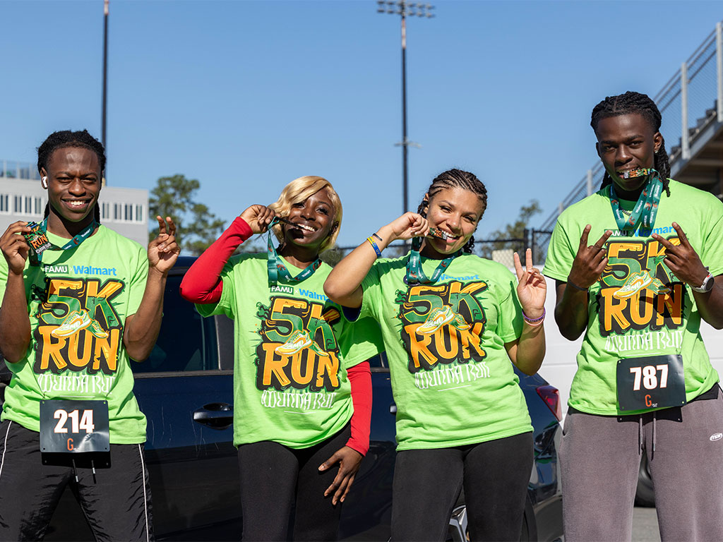 Participants proudly display their medals following the fifth annual Walmart-sponsored FAMU Homecoming 5K Run/Walk on Thursday, Oct. 22, 2026, at Bragg Memorial Stadium. The event, held in collaboration with Gunna's Wunna Run Club, brought together more than 850 runners to promote health, wellness and community engagement.  Photo courtesy of Jeff Adams.