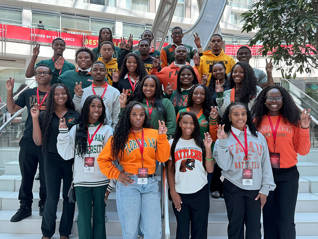 Florida A&M University students proudly throw up their Rattler strikes while attending a Thurgood Marshall College Fund event. The gathering provided opportunities for students to connect with peers, strengthen leadership skills and explore professional development opportunities.