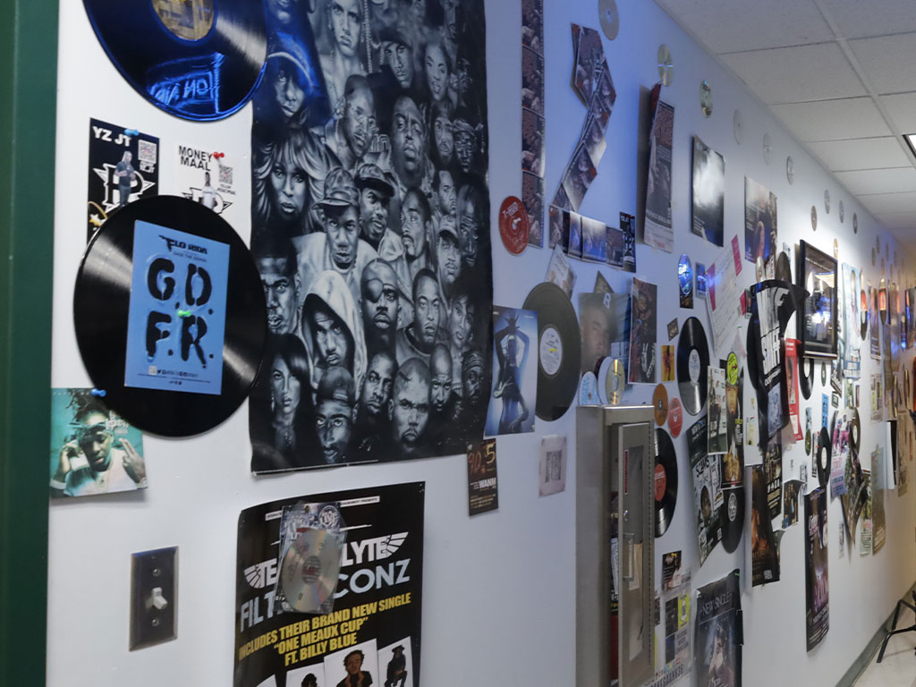 A hallway inside FAMU's WANM 90.5 FM features vinyl records, music posters and memorabilia reflecting the station's rich broadcasting history and connection to music culture. Known as "The Flava Station," WANM celebrates 50 years of student broadcasting and creative expression.
