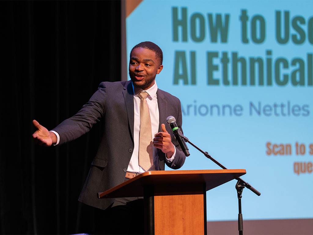 Khalil-Lullah Ballentine at an AI conference for students. 