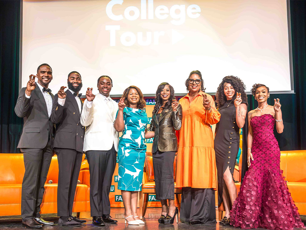 FAMU President Marva B. Johnson, J.D., Provost and Vice President for Academic Affairs Allyson L. Watson, Ph.D., and members of “The College Tour” cast throw the Rattler hand sign following the premiere screening and panel discussion at Lee Hall Auditorium. Photo courtesy: Jeff Adams, FAMU University Photographer.
