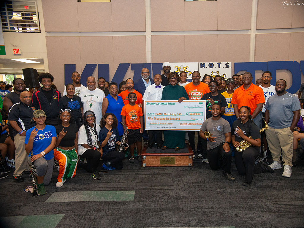 Dr. Shelby Chipman is presented with a $50K gift to the Beyond the Uniform Campaign