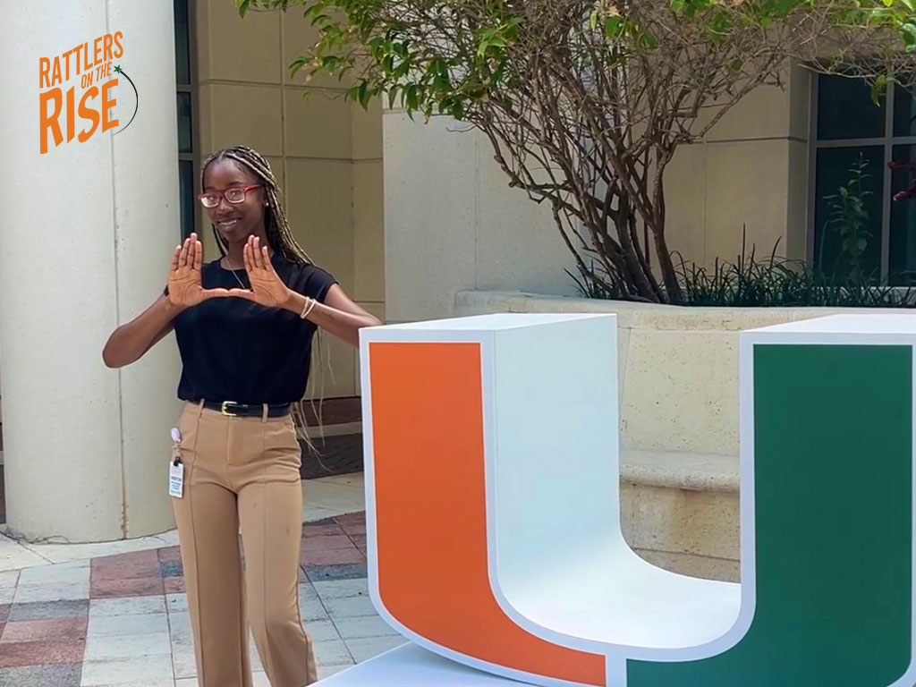 Bliss Quant throwing up the U at the University of Miami where she completed a summer internship