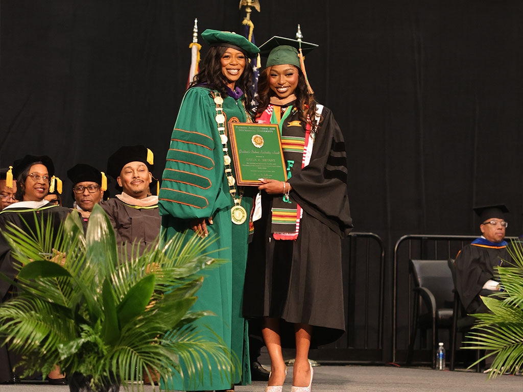 Outgoing SGA President Zayla Bryant and President Johnson