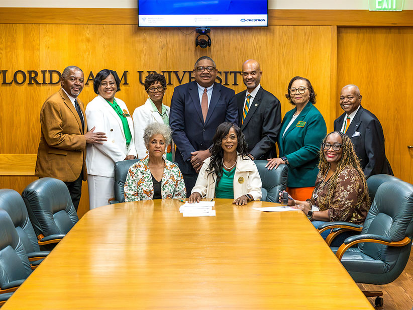 President Johnson and Health Sciences administrators at document signing