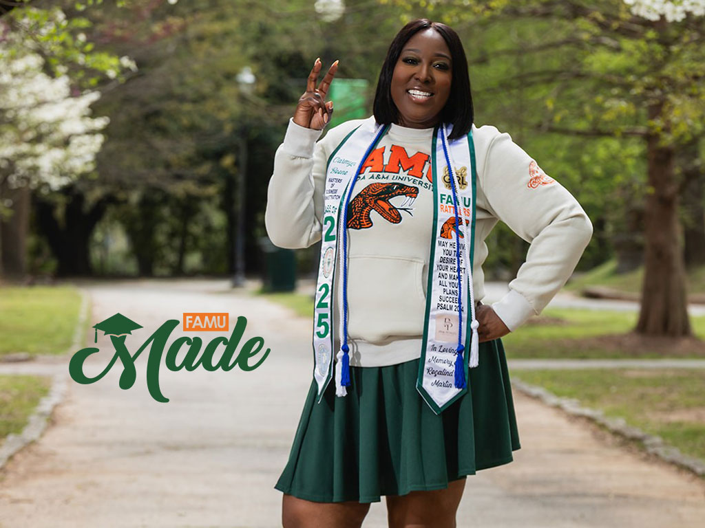 2025 Camryn Boone standing among blooming trees showing her rattler fangs
