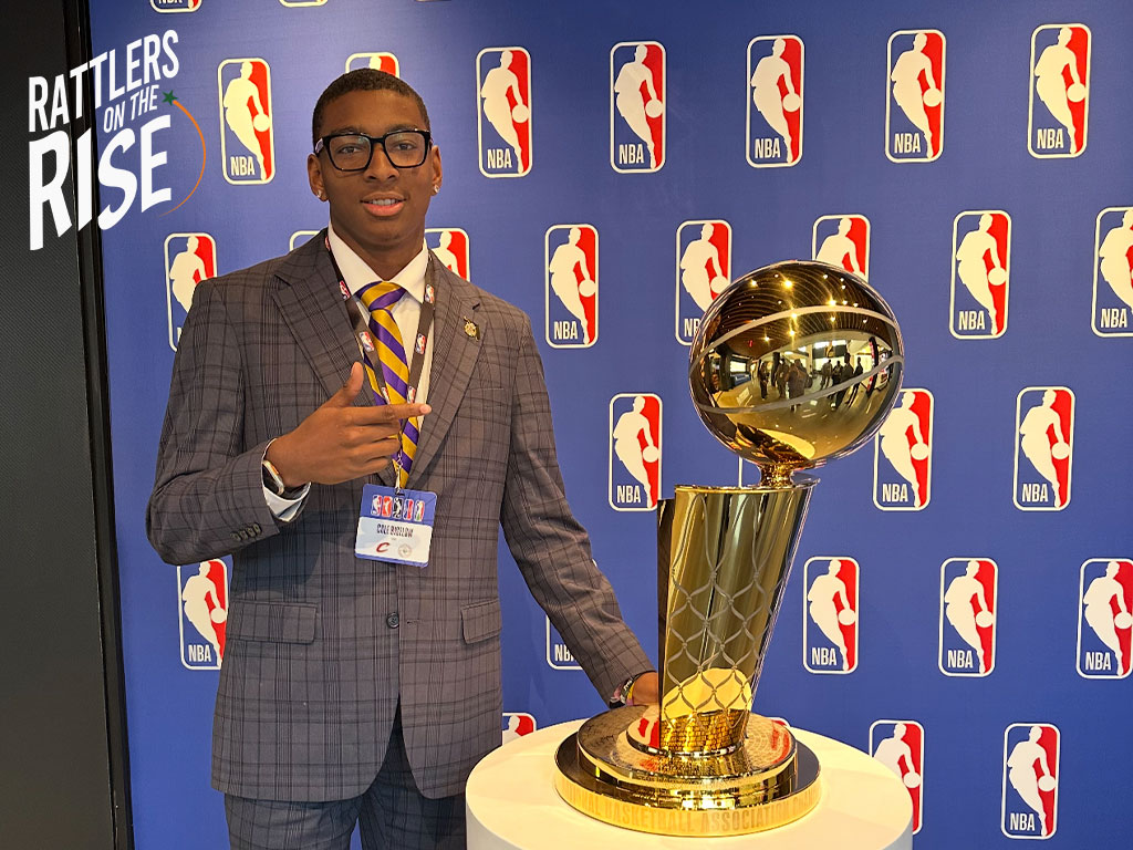 Cole Bigelow poses with NBA Championship Trophy