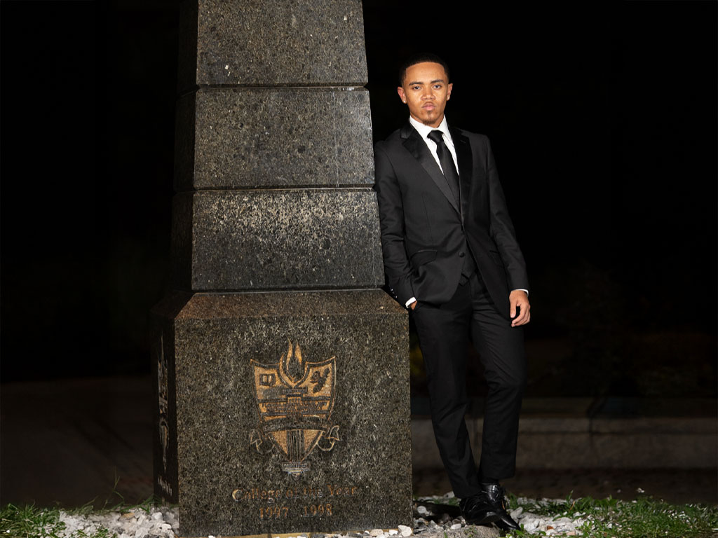 Williams poses infront of Eternal flame on FAMU campus. 