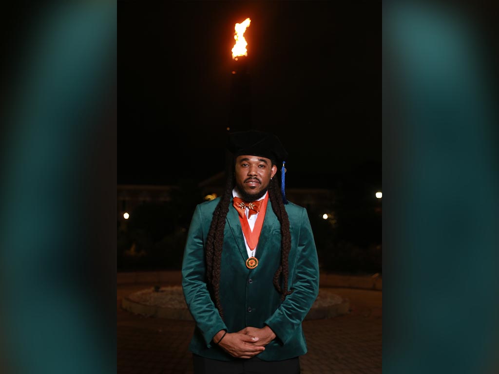 Dr.Johnson poses infront of the eternal flame.  