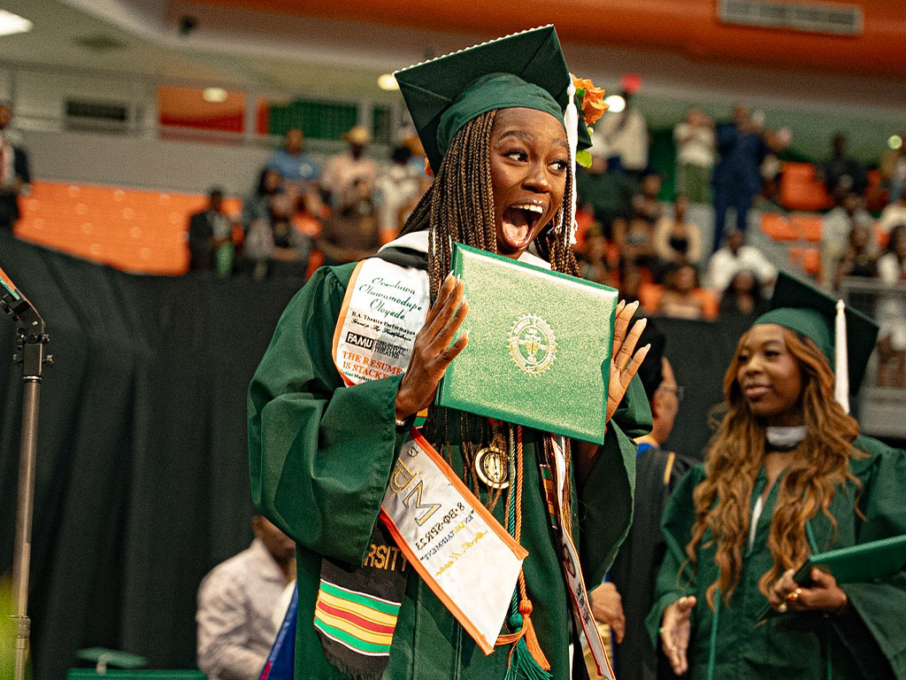 Oluwamodupe “Dupe” Oloyede makes a joyful noise after receiving her degree. (Photo by Orlando Nieves)