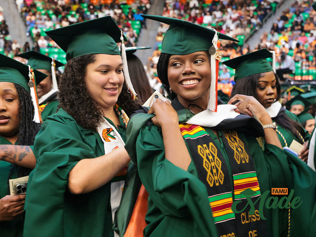 FAMU grad fixing friends hood