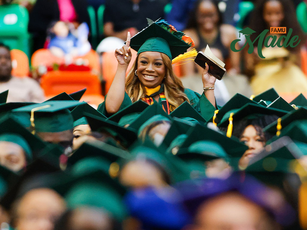 One girl graduate in the crowd