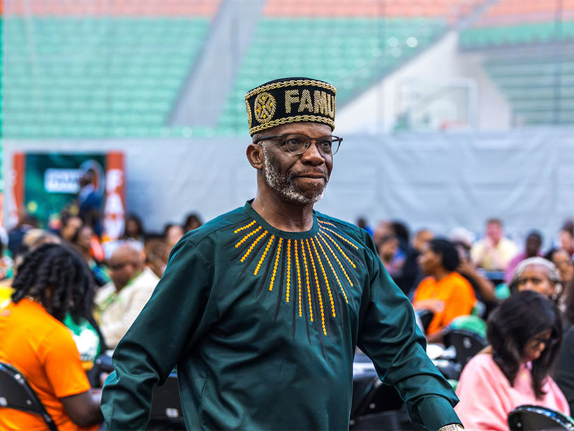 Faculty member with a unique FAMU hat