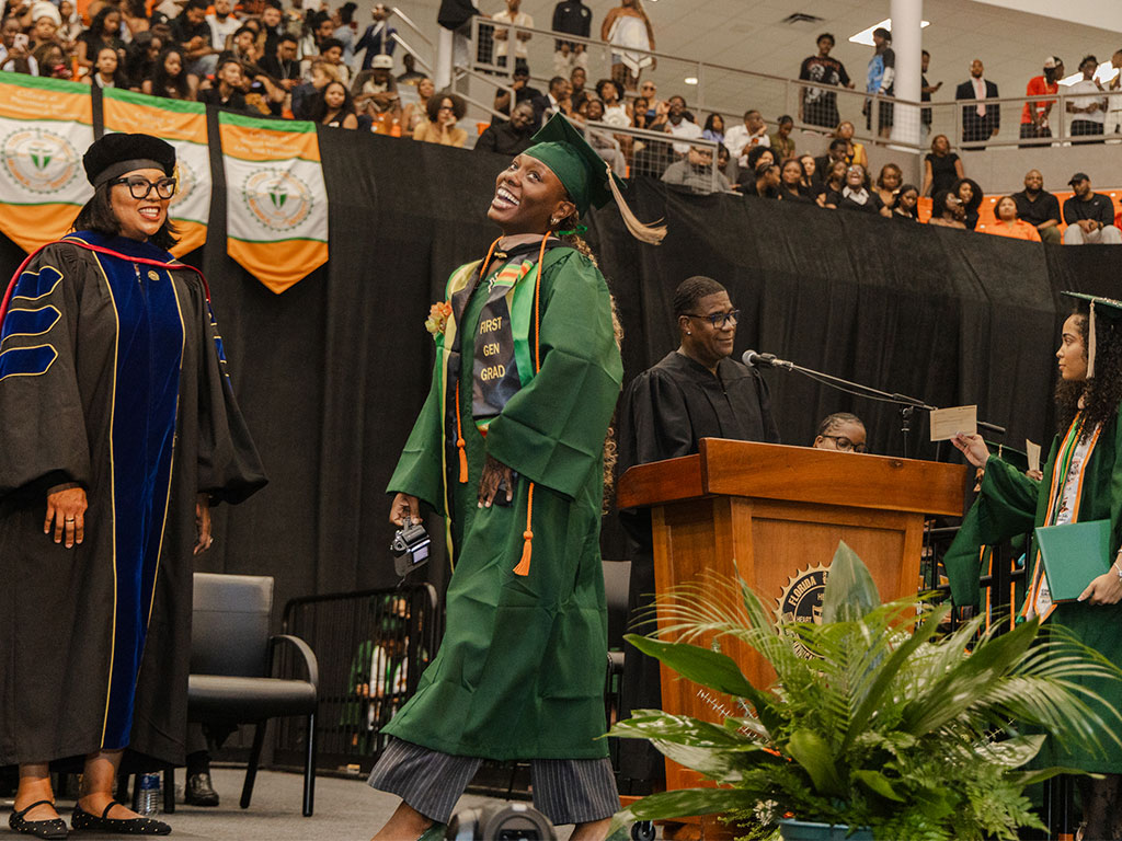A first-generation college graduate celebrates after receiving a diploma during Florida A&M University's Summer 2026 Commencement Ceremony at the Alfred Lawson Multipurpose Center and Teaching Gymnasium. (Photo courtesy of Michael Cork.)