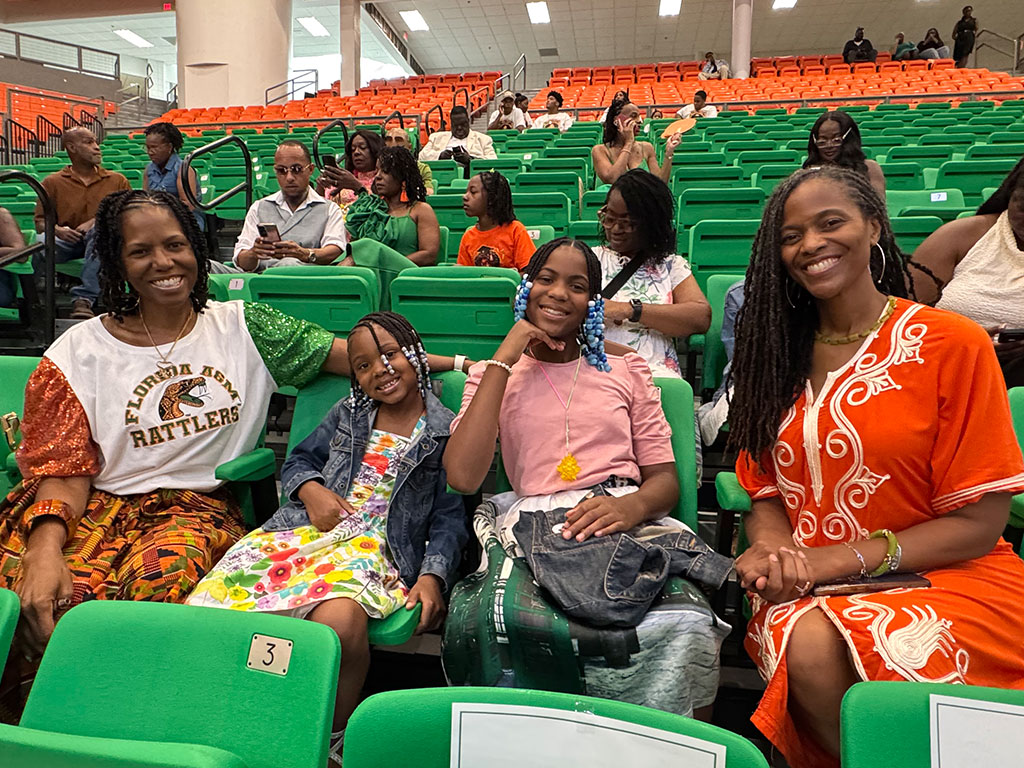 Family members gather at Florida A&M University's Summer 2026 Commencement Ceremony to celebrate accounting graduate Hanif Harris. Reba Kelsey traveled from Atlanta for the occasion, made even more meaningful as Harris' 101-year-old grandfather watched him cross the commencement stage. (Photo courtesy of Michael Cork.)