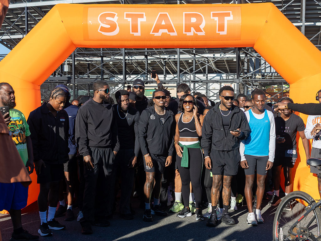 Participants gather beneath the starting arch at Bragg Memorial Stadium for the Wunna Run Club 5K during FAMU’s 2026 Homecoming celebration. Photo courtesy of Jeff Adams.