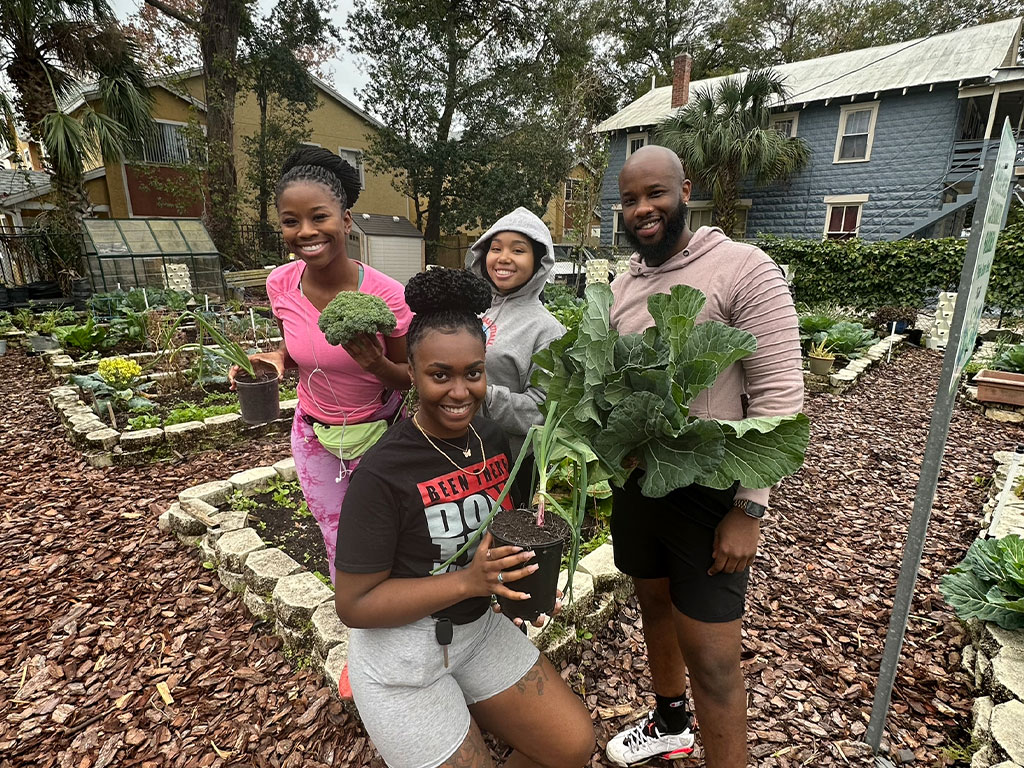 Parramore Garden Photo: (L to R) Martika Major, Khadidja Diouf, Brianna Neblett, and fellow Alum Reginald Penn in the Parramore Community Garden