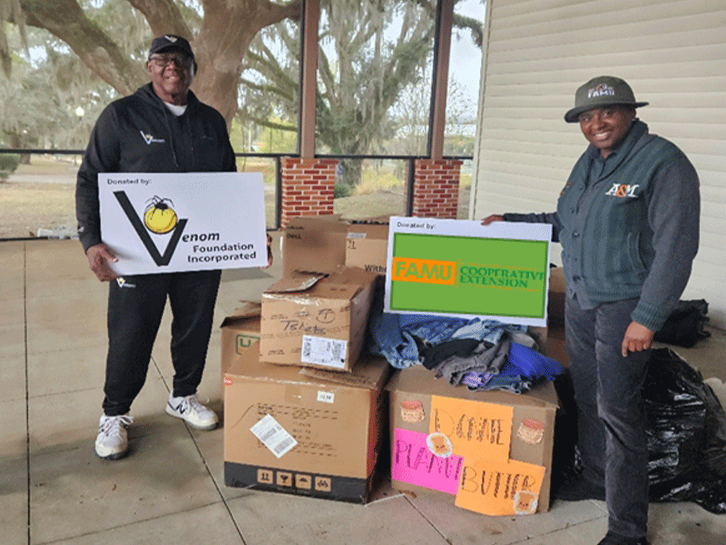 Cooperative Extension Agents with donations for Jamaica.