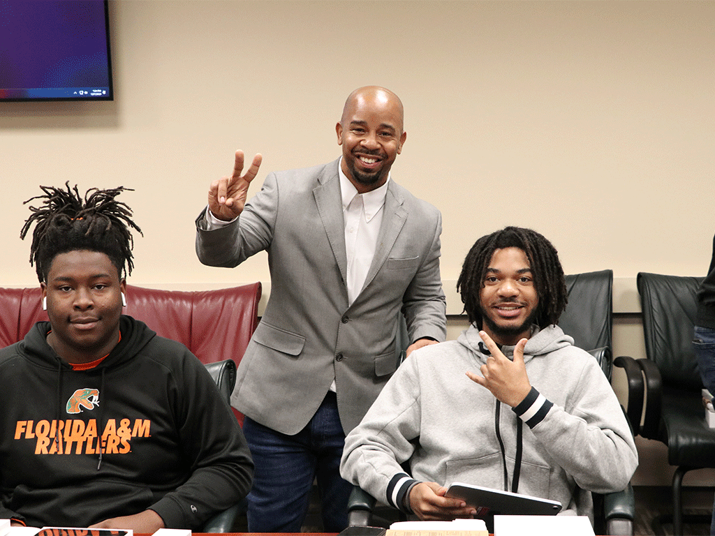 Two students and professor