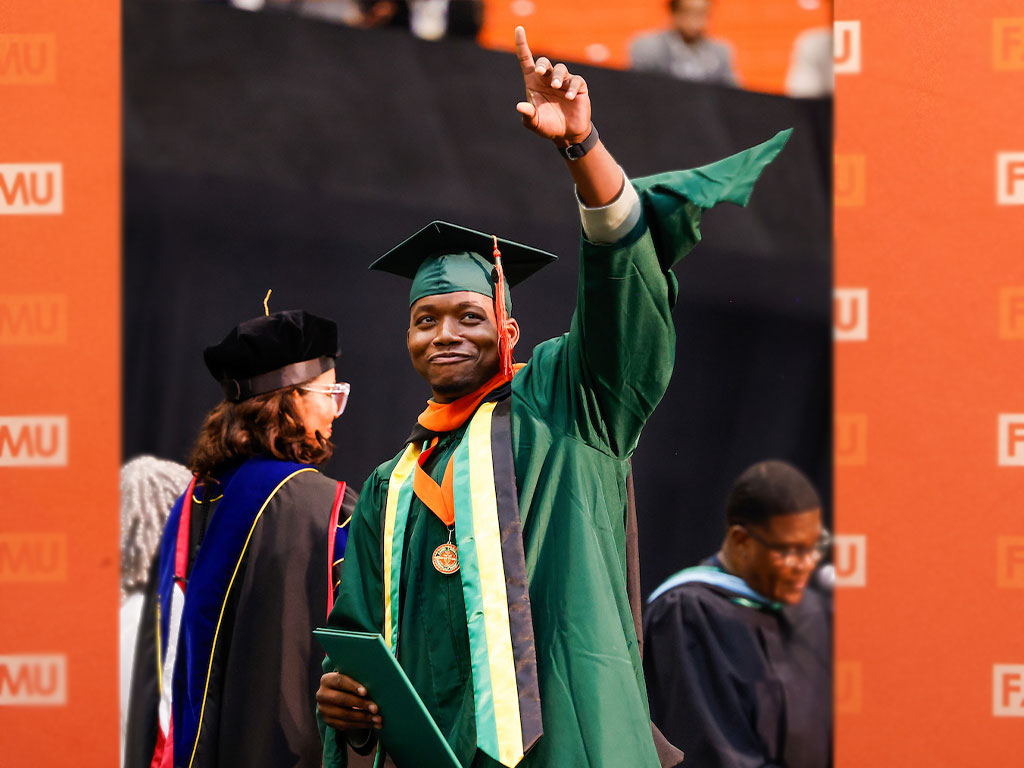 Grad raises one finger in the air