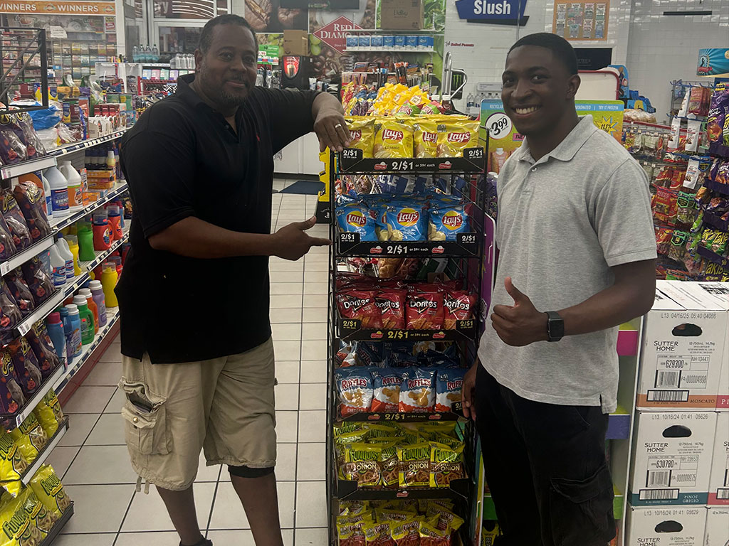Justin Thompson in a convenience store near a Frito Lay display