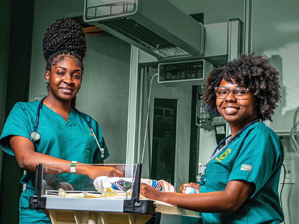 Nursing students with Infant