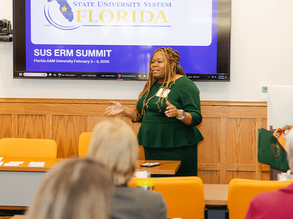 AVP Deidre Melton speaking at a ERM summit
