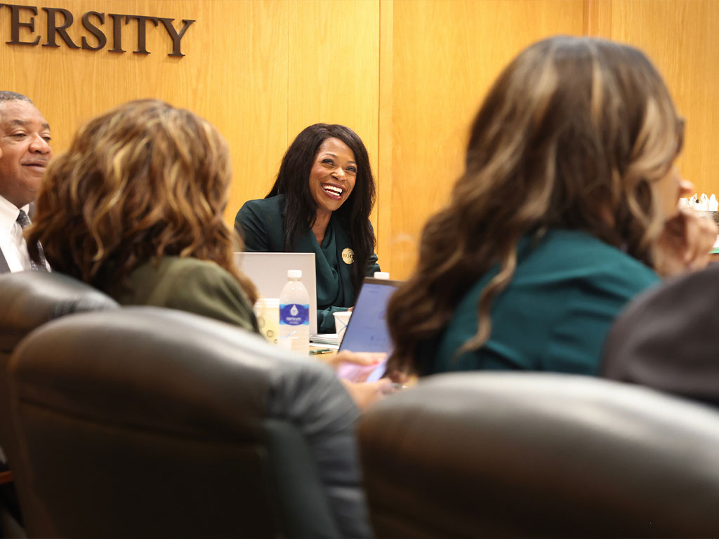 President Marva Johnson J.D., shares a laugh with her senior leadership team during her first week as president of FAMU.