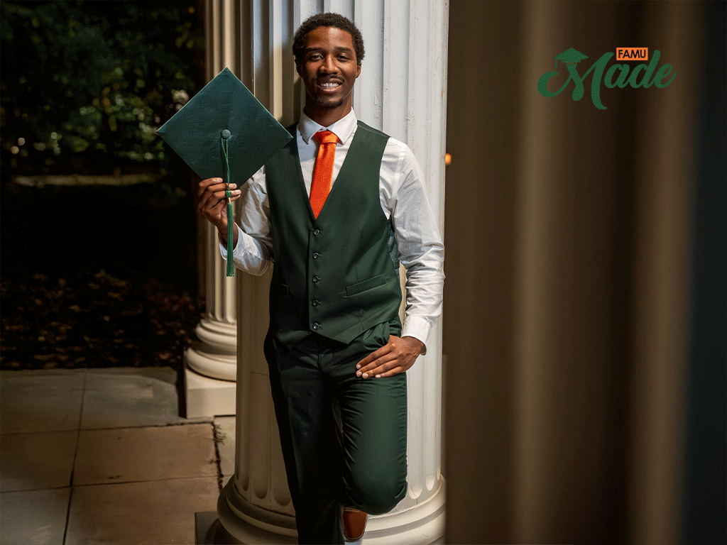 Charles Rackley posing for his graduation photo.