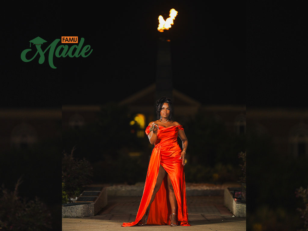 Elementary Education Major Errion Robinson Poses With the Eternal Flame Ahead of Her Graduation on Friday, Aug. 1