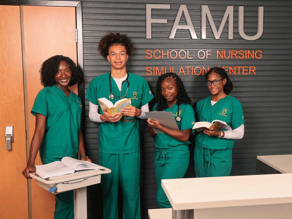 Nursing students in front of the FAMU Nursing Signage