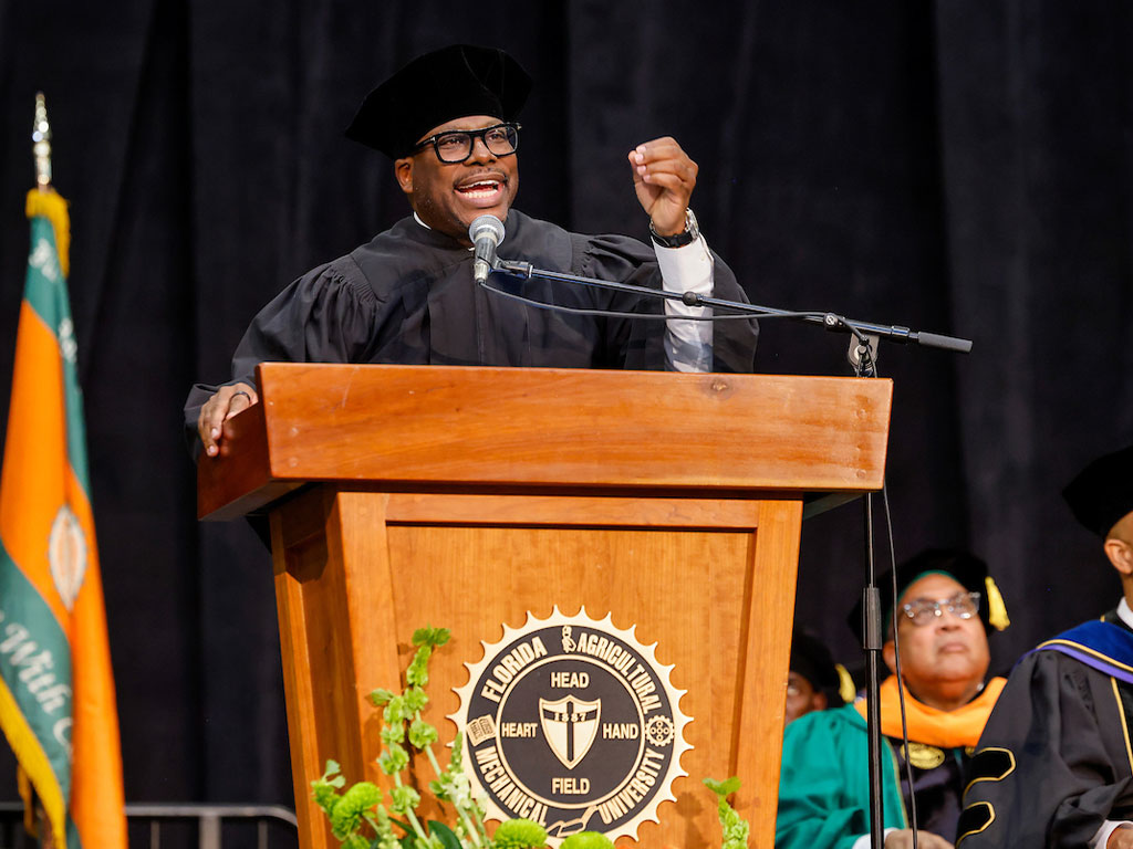 Laterras Whitfield at the podium delivering FAMU Summer 2025 commencement address
