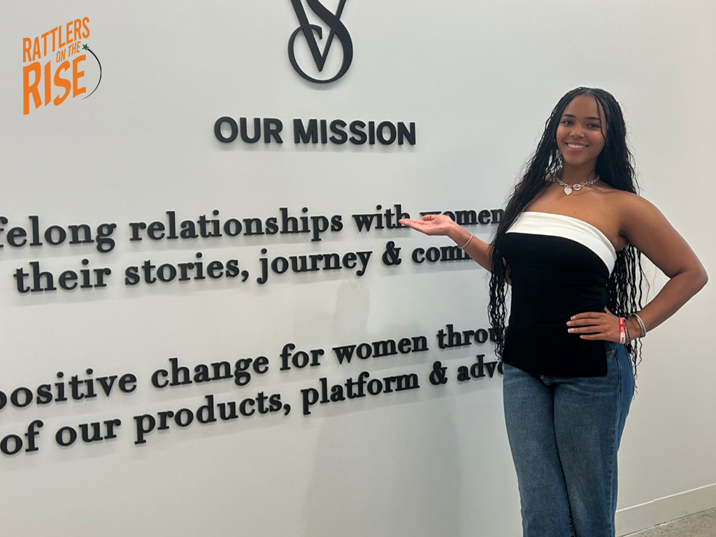 Chailyn poses infront of VS mission statement 