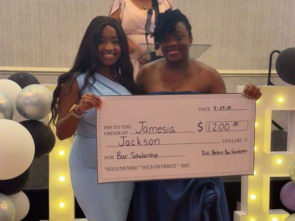 Jamesia Jackson and $1200 scholarship check
