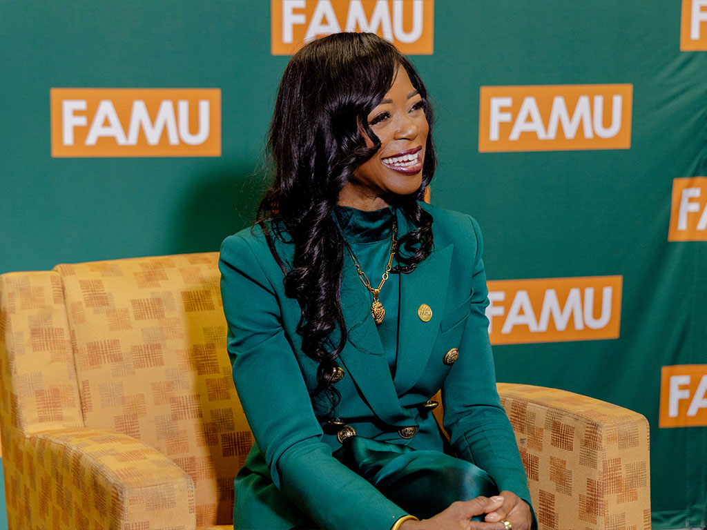 President Johnson smiling during an interview.