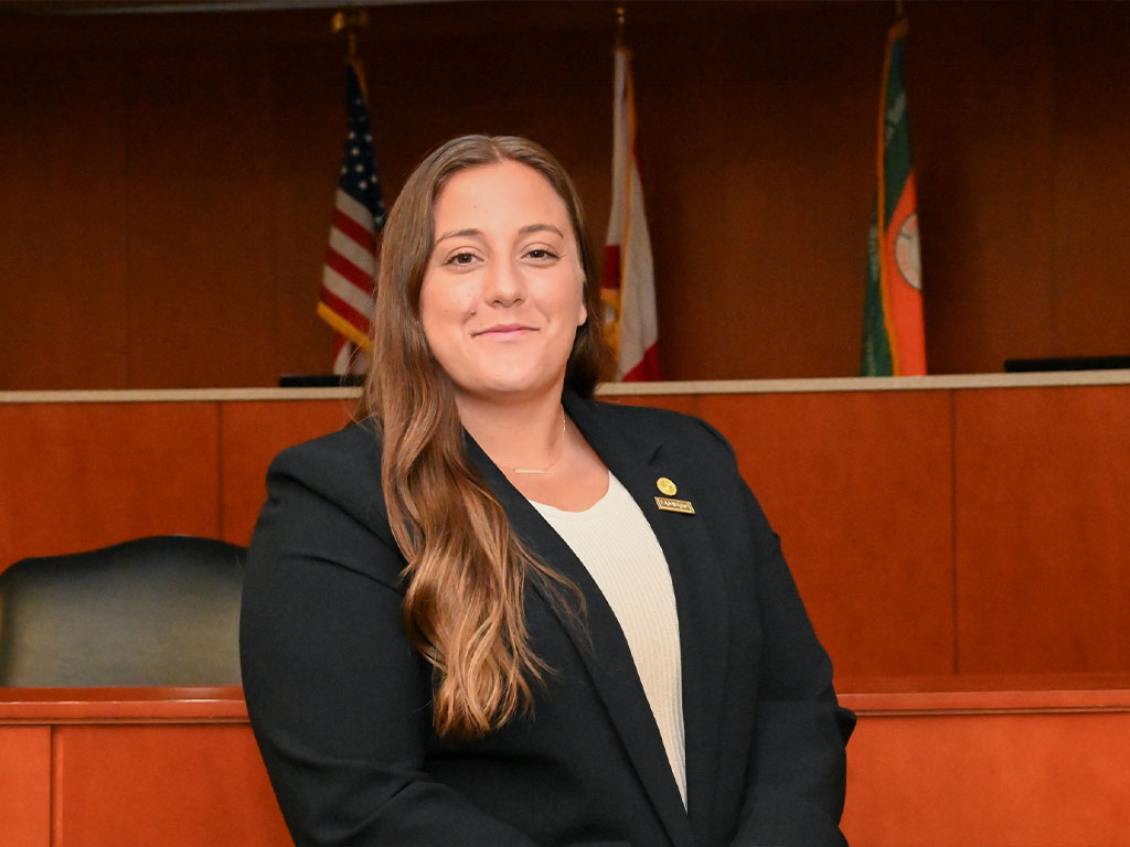 Kayla Carestia poised photo in the courtroom.