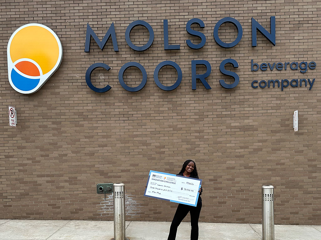 Florida A&M University senior Lauren Mickens poses with a ceremonial $3,000 check after earning first place in the Molson Coors x Thurgood Marshall College Fund Innovation Challenge. The national competition marked Mickens' second first-place case competition victory of the year, further showcasing her leadership, strategic thinking and supply chain management expertise. (Photo courtesy of Lauren Mickens.)
