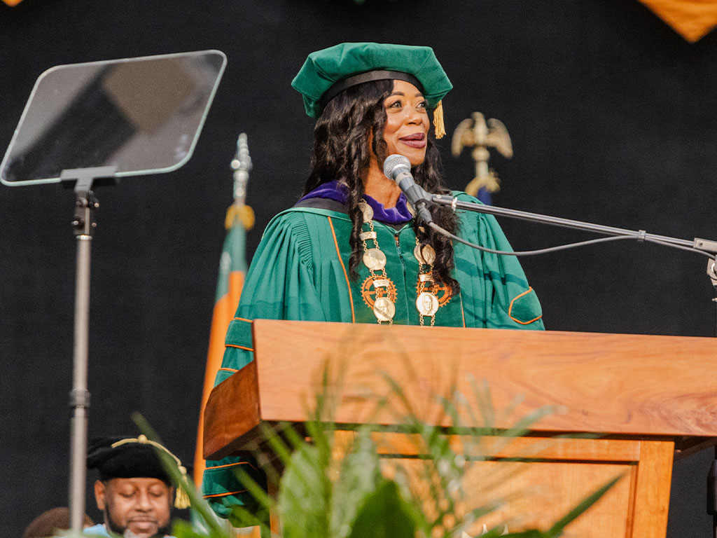 Florida A&M University President Marva Johnson, J.D., addresses graduates during the University's Summer 2026 Commencement Ceremony at the Alfred Lawson Multipurpose Center and Teaching Gymnasium. Johnson congratulated the Class of 2026 and encouraged graduates to embrace the opportunities that lie ahead. (Photo courtesy of Michael Cork.)
