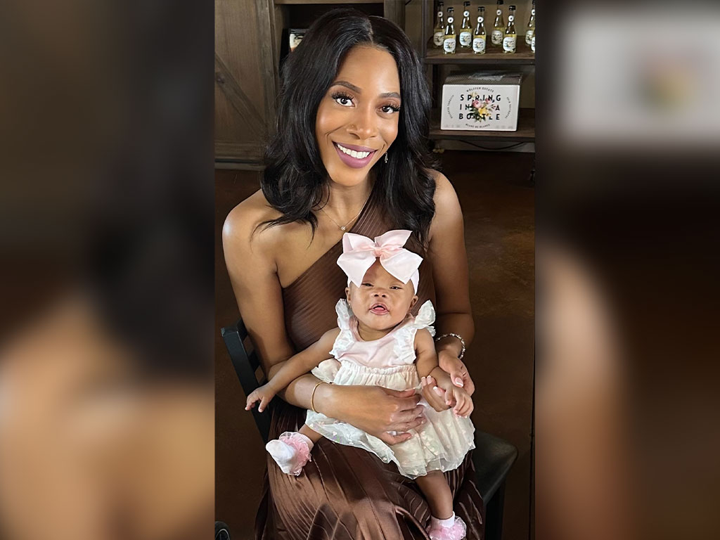 Michelle Fredrick holds her daughter, one of her greatest sources of motivation throughout her doctoral journey. While balancing motherhood, a full-time role at the Centers for Disease Control and Prevention, and doctoral studies at Florida A&M University, Fredrick remained committed to earning her Doctor of Public Health degree. (Photo Courtesy: Michelle Fredrick)