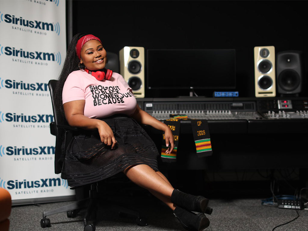WANM 90.5 FM alumna Nadia Sharís Felder poses inside a SiriusXM studio. Felder credits her experience at FAMU's student-run radio station with helping her develop the confidence and communication skills that have shaped her professional career.