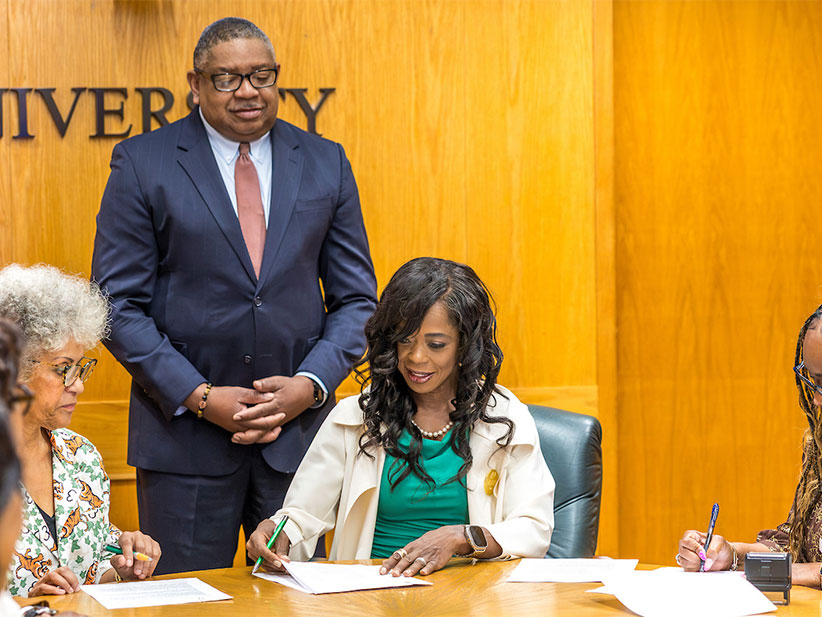 Celeste Hart and President Marva Johnson at Brickler building signing.