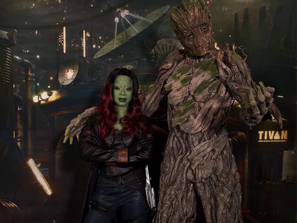 Florida A&M University alumna Rae’Kwan Bostic appears as Gamora alongside Groot, bringing iconic characters to life through her work in themed entertainment.