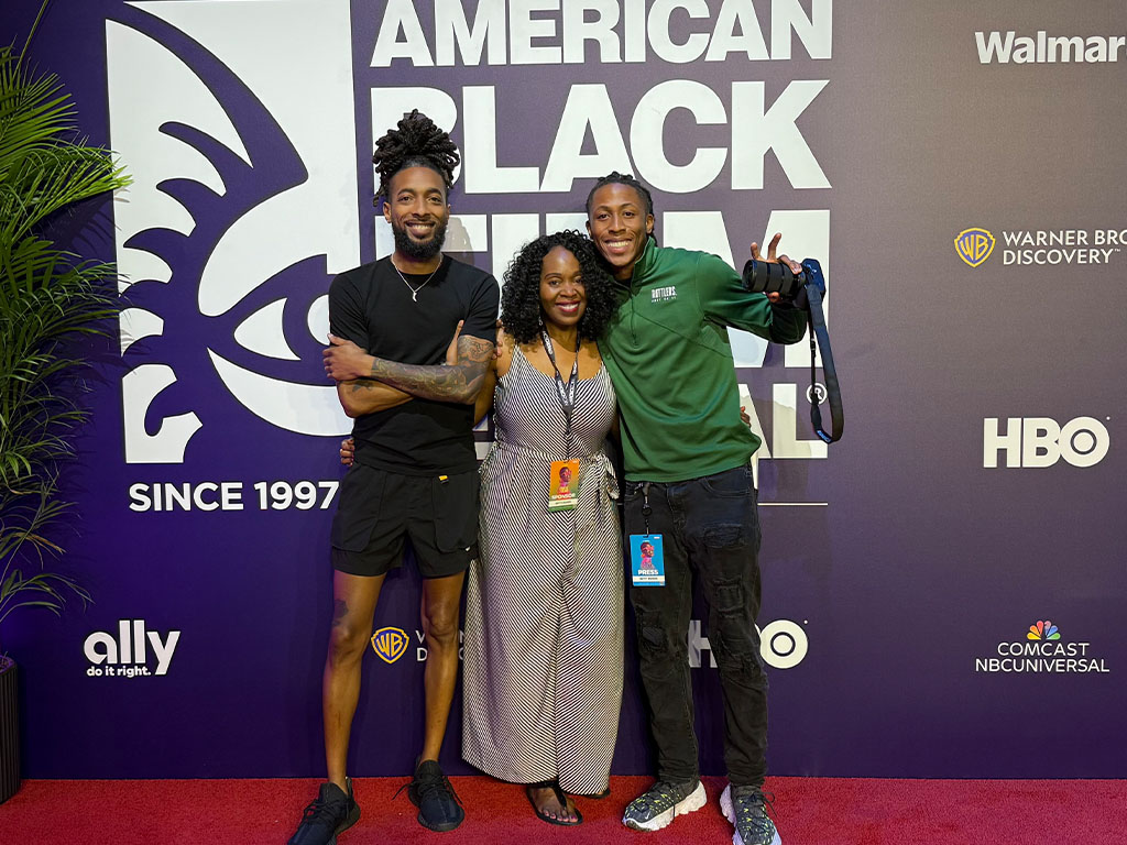 Florida A&M University graphic design student Treyvon Eugene (right) poses with Getty Images photographer Arturo Holmes and Vice President of Partnerships Cassandra Illidge at the 2025 American Black Film Festival. (Credit: Cassandra Illidge)