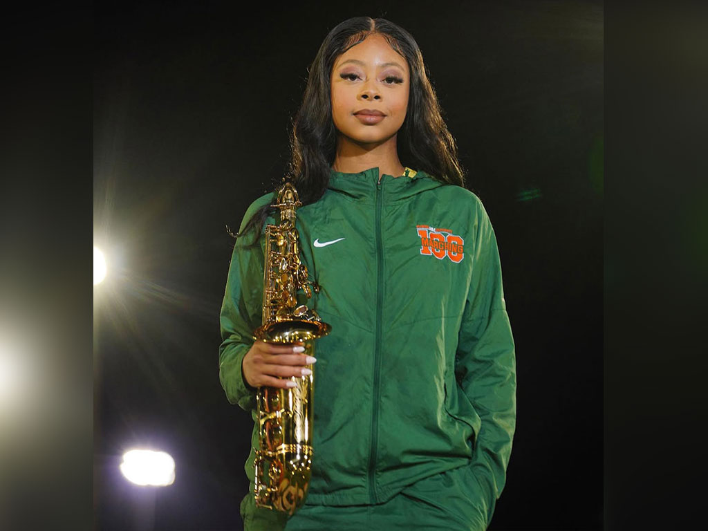 Florida A&M University student Rae’Kwan Bostic poses with her saxophone as a member of the Marching 100.