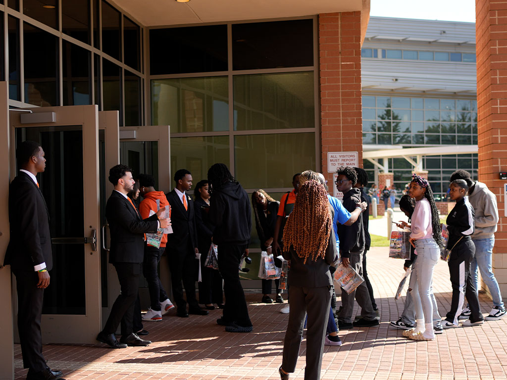 Florida A&M University student leaders welcome prospective students to a recruitment event, offering a firsthand look at the Rattler experience and opportunities for campus involvement.